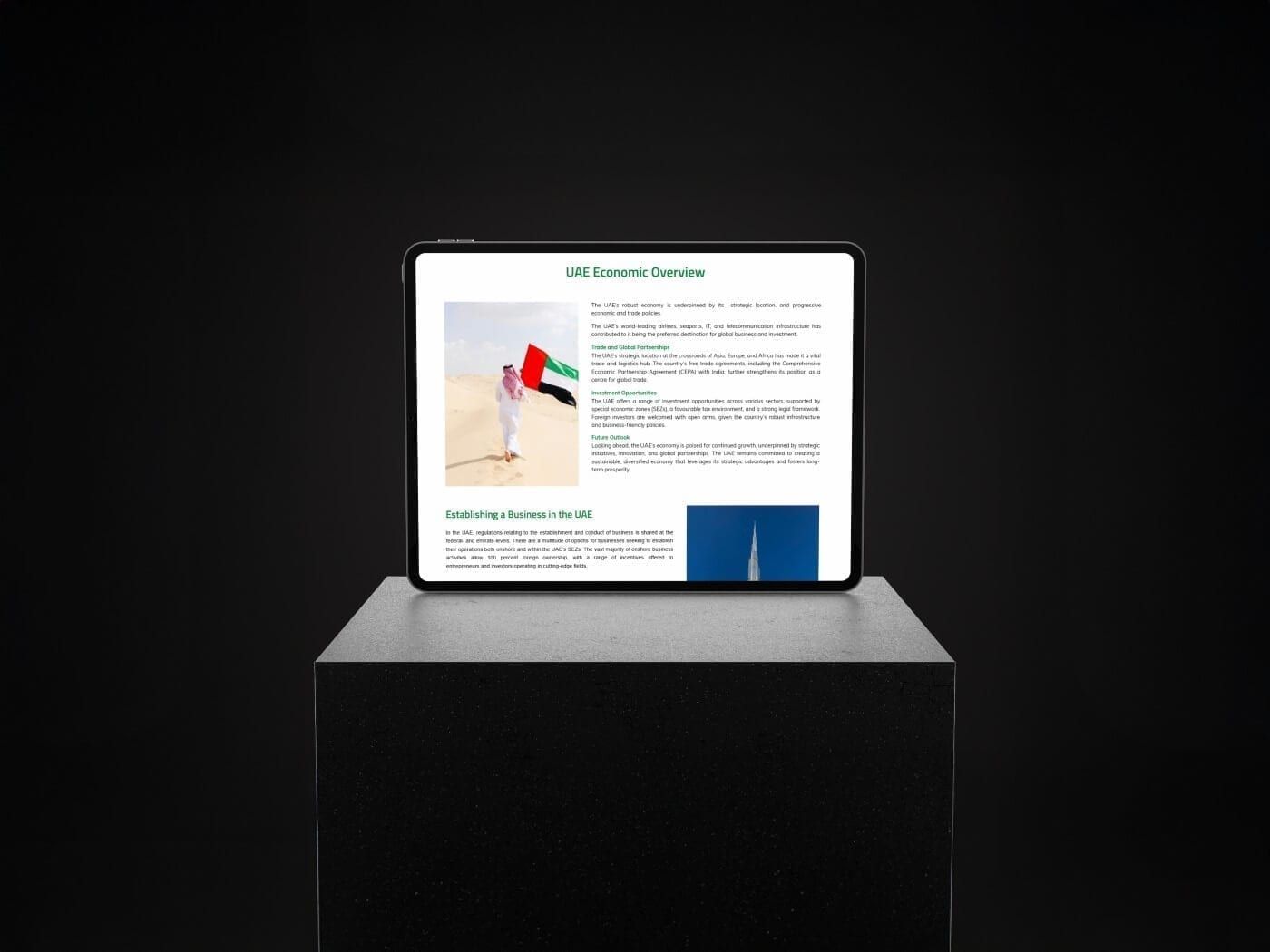 Tablet on a plinth showing an economic overview page